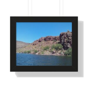 Lake with rocky cliffs and blue sky.