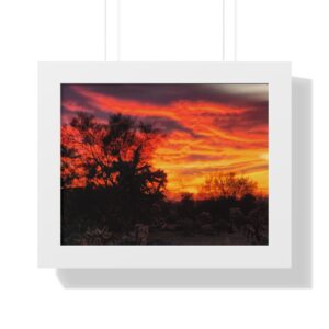 Cactus silhouettes beneath glowing striped sunset clouds
